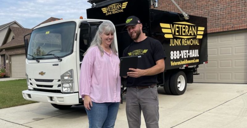 Veteran Junk Removal expert quoting customer for junk removal services