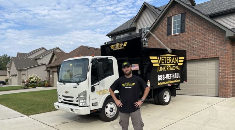 veteran junk removal pro in front of truck